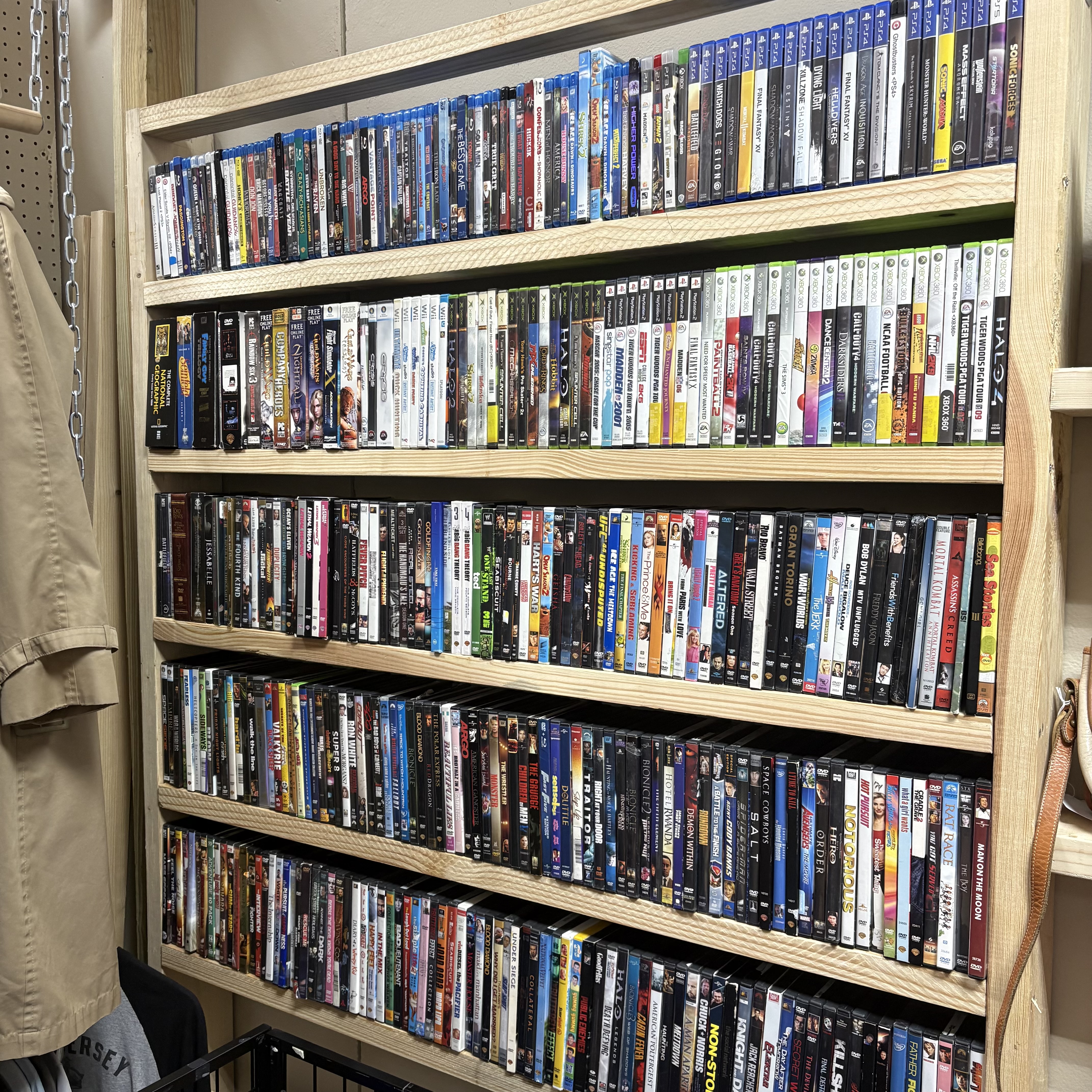 Shelves filled with Blu-ray, DVD, and video game cases